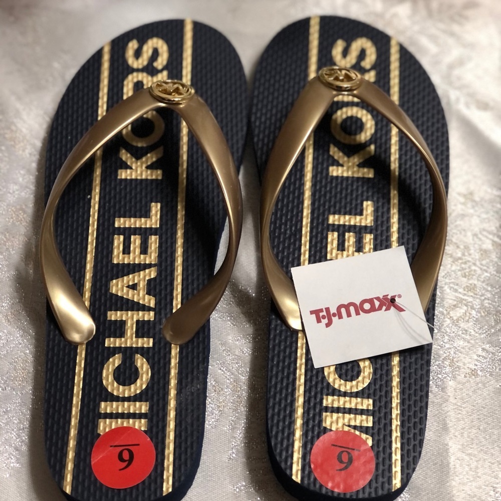 2 pairs of Michael Kors Flip Flops.